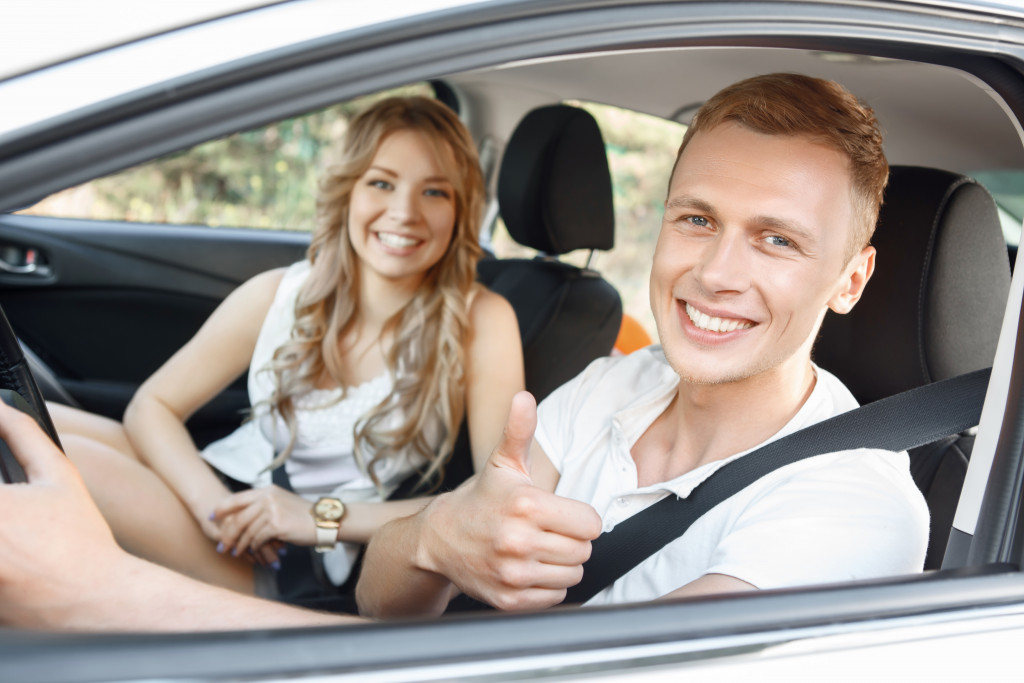 guy in car with his girlfriend