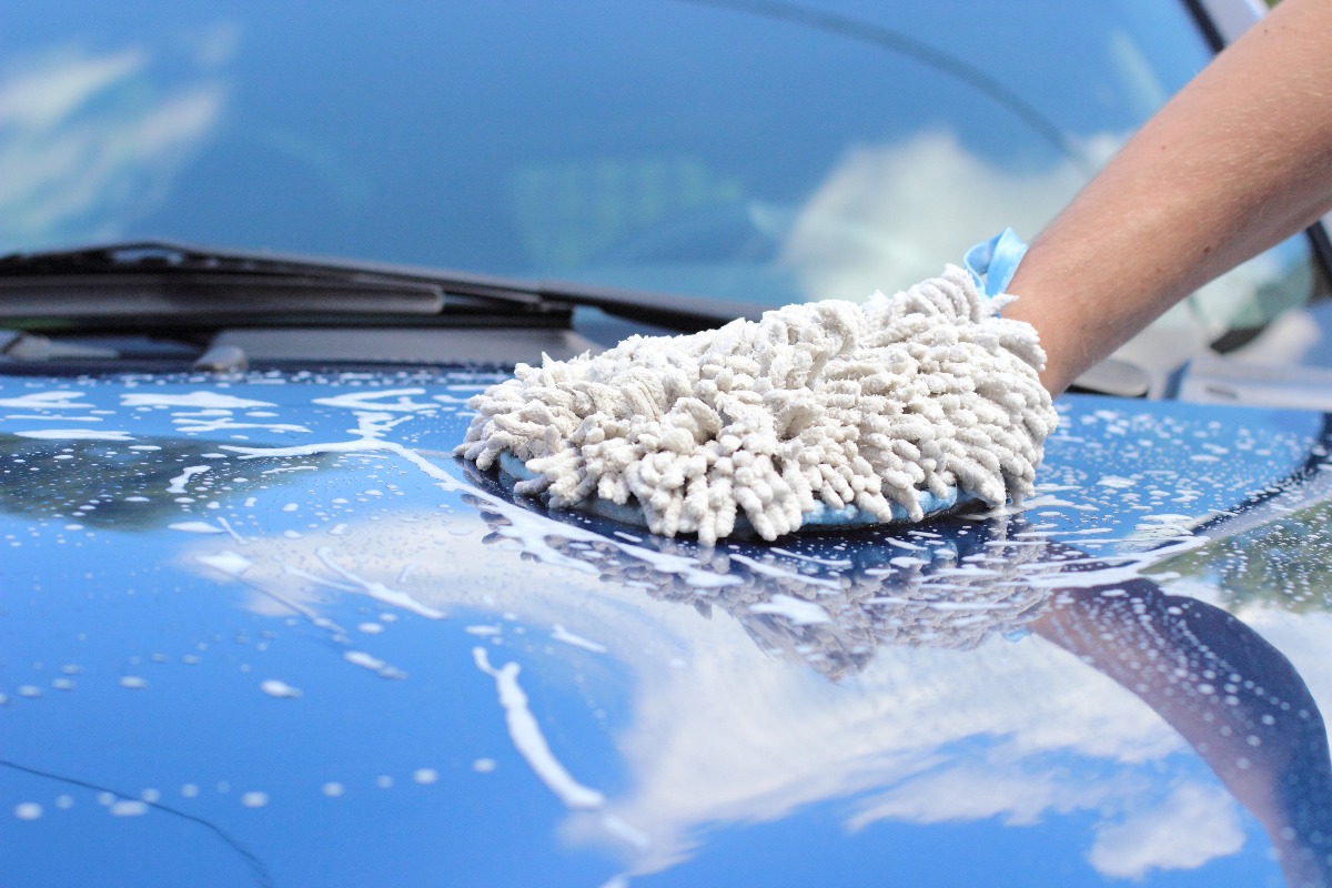 person washing a car