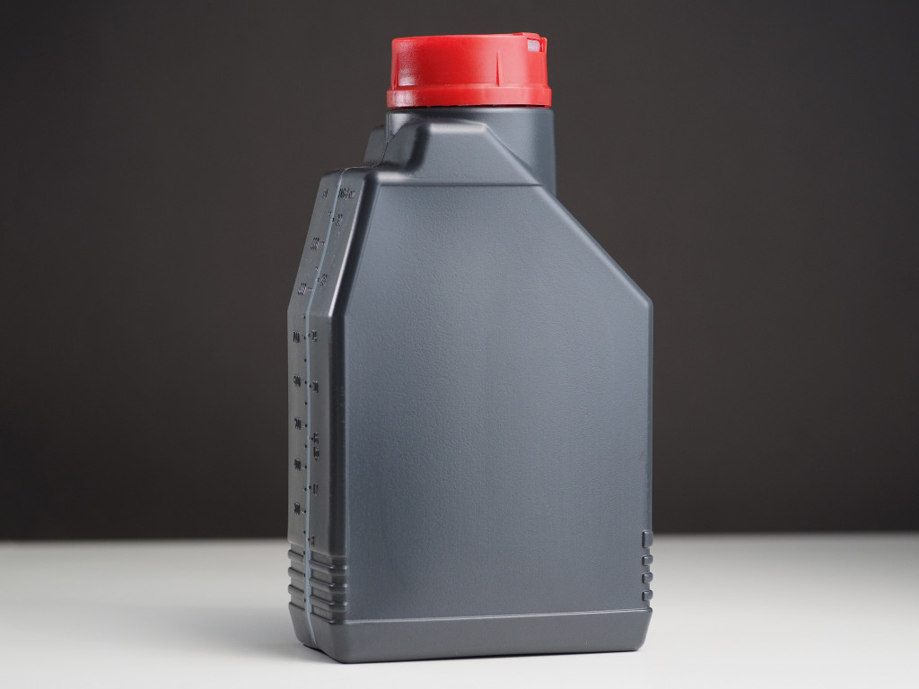 A gray engine oil canister