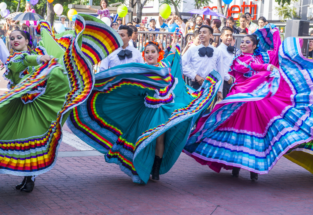 Colombian women in their traditional clothing dancing