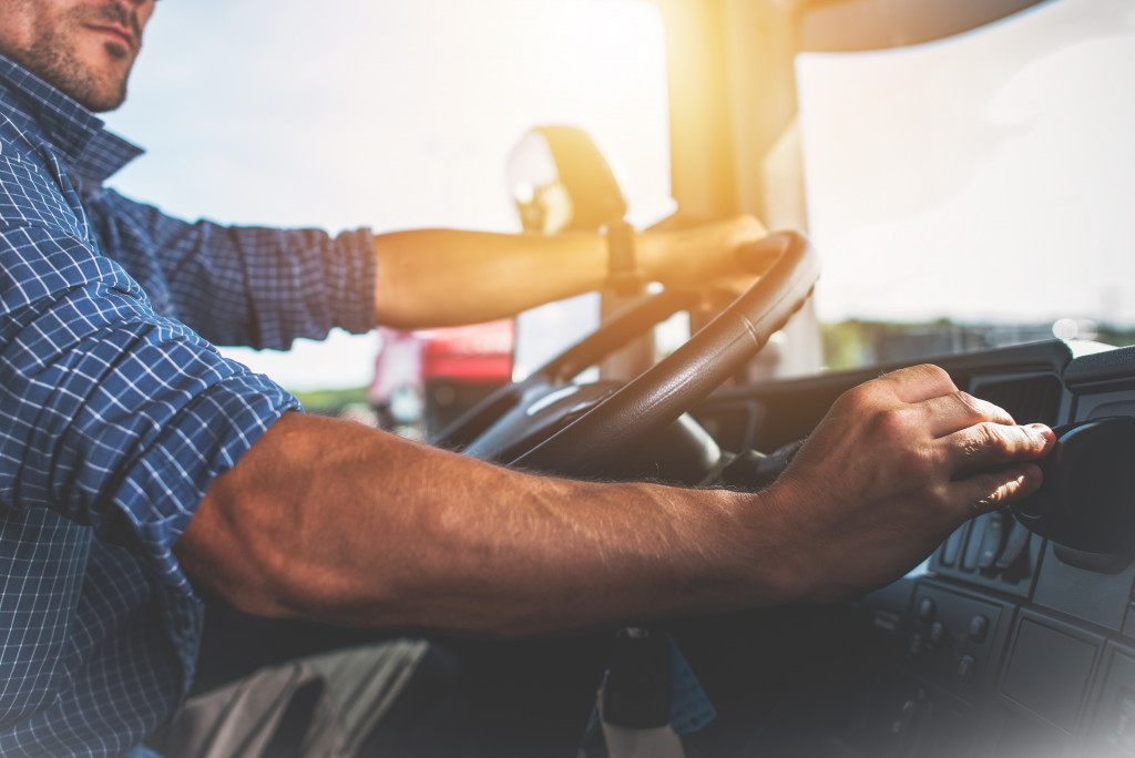 A driver operating a truck during sun down