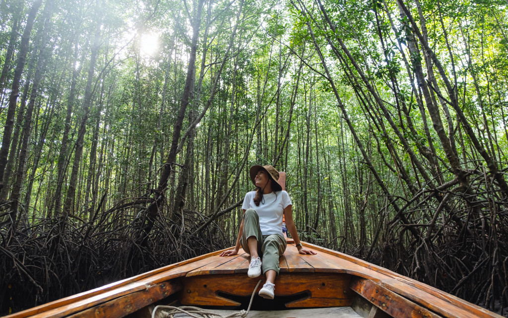 woman on a small boat in a jungle river