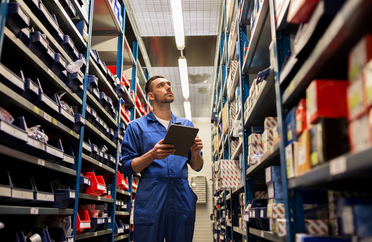 man checking auto parts supplies 