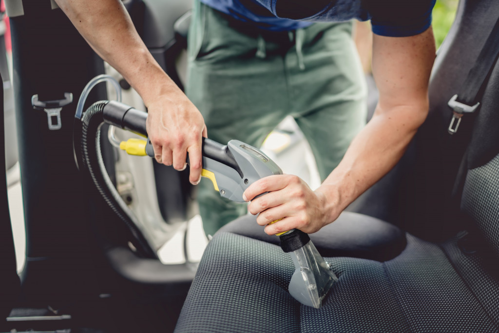 cleaning a black car interior